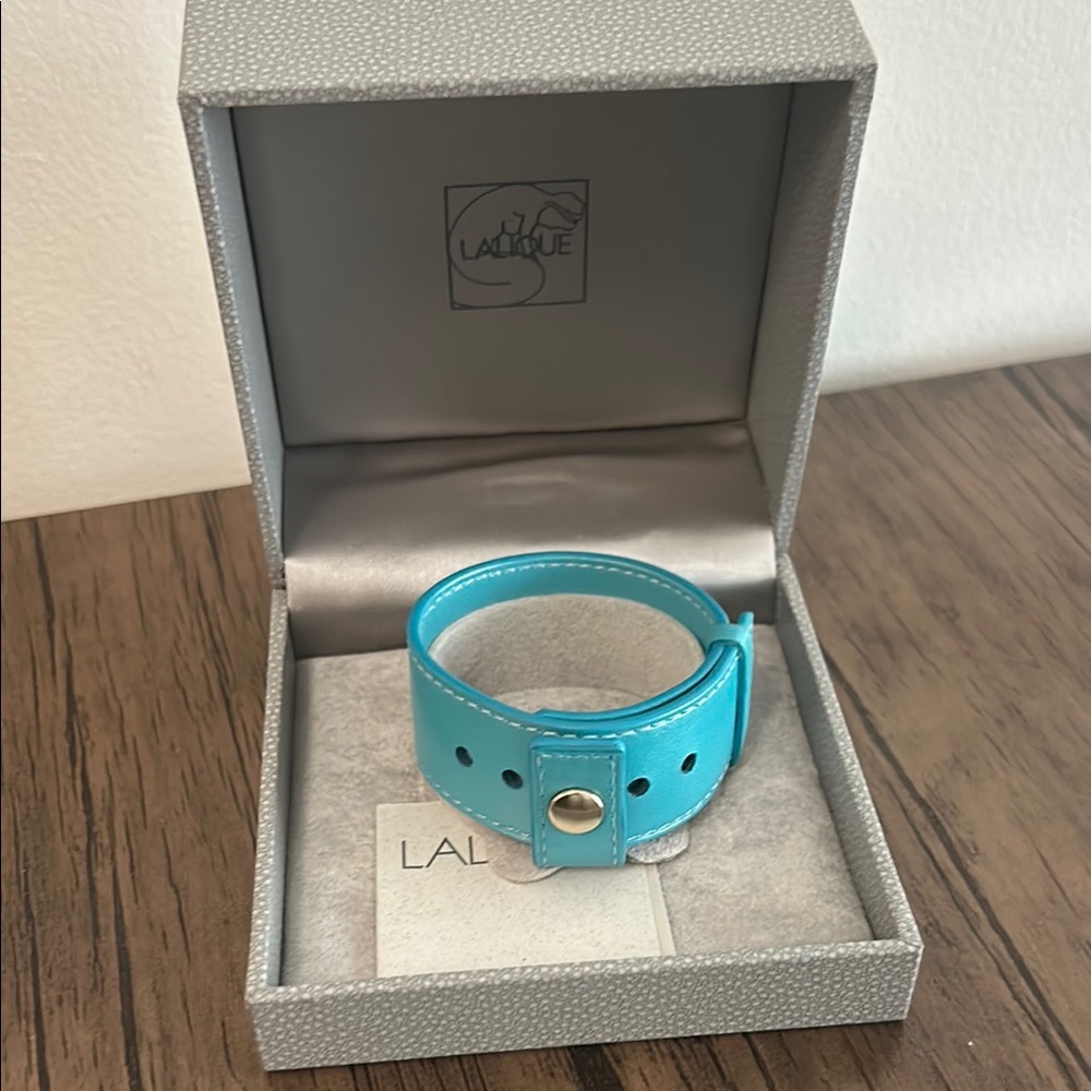 Never worn Lalique lamb skin leather bracelet